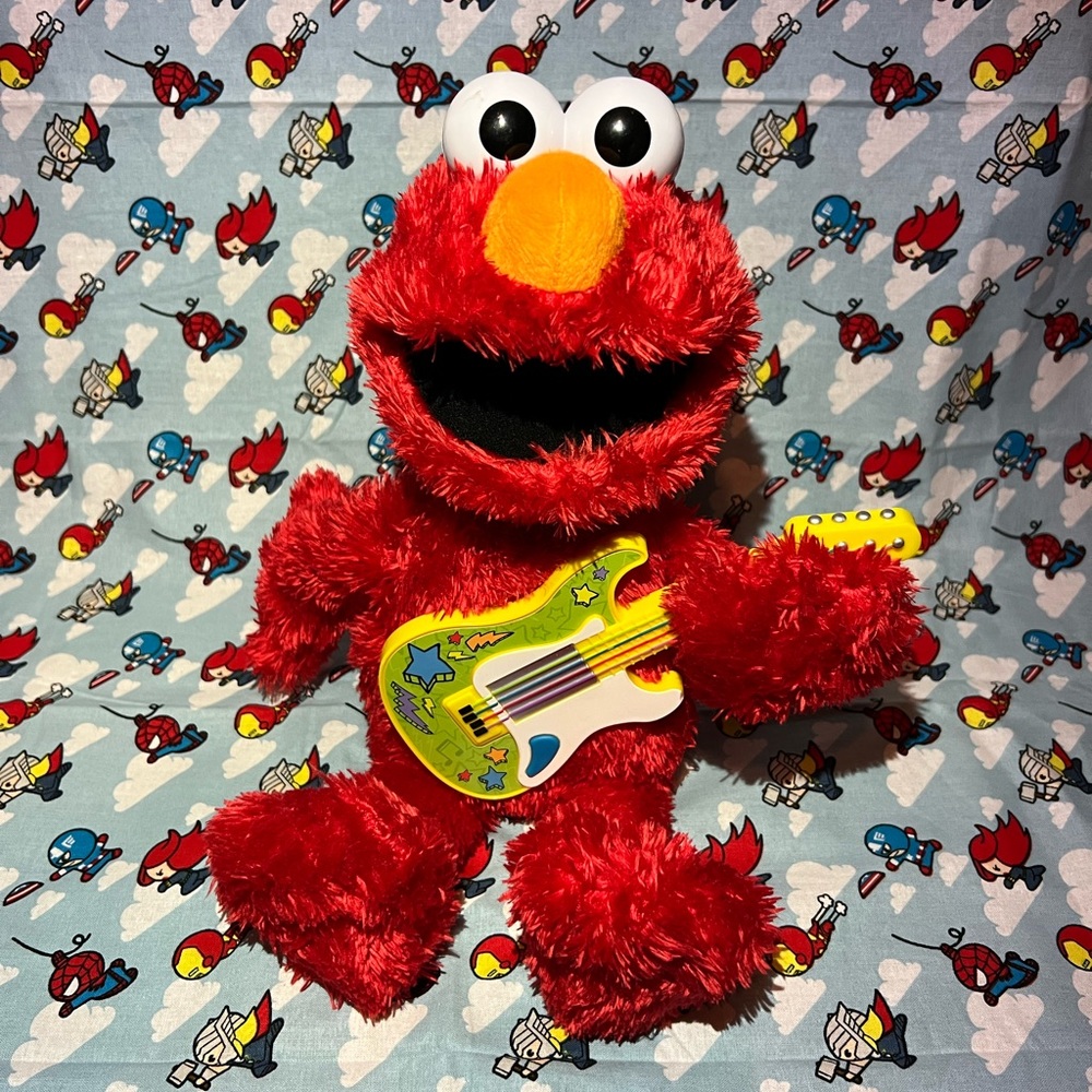 Sesame Street Rock and Rhyme Elmo Talking, Singing 14-Inch Plush Toy for Toddler